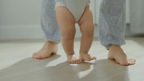 First steps of a baby Stock Footage 143353126