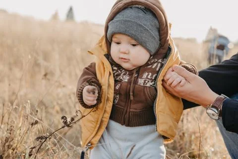 First steps of the boy child in nature in autumn Stock Photos