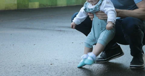 First steps of a child with father Stock Footage 108722578