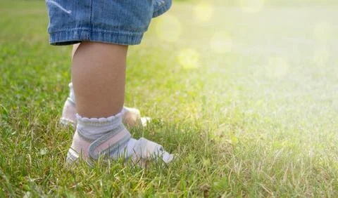 The first steps of the kid. Stock Photos