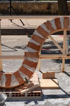 First structure of bricks and plaster on a construction site, building materials Fotos de archivo