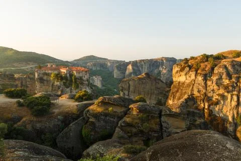 First sun rays on the Holy Monastery of Varlaam on the edge of high rock Stock Photos