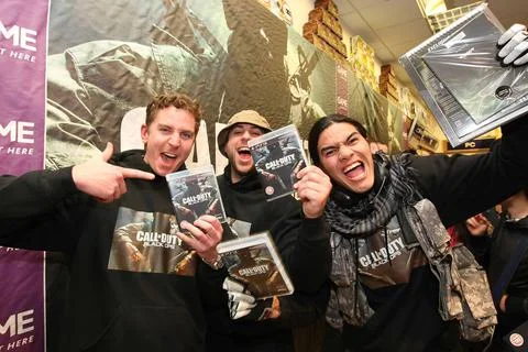 The First Three Persons In The Queue Who Waited Hours To Buy A Copy Of The New C Stock Photos