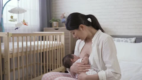 First time mom feeding her new baby with milk Stock Footage 148768983
