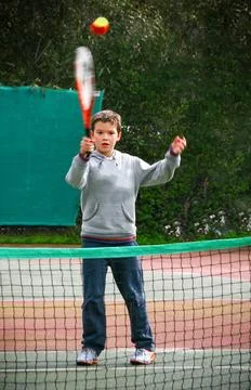 First trainnig tennis lessons.Boy learn how to play play tennis Stock Photos