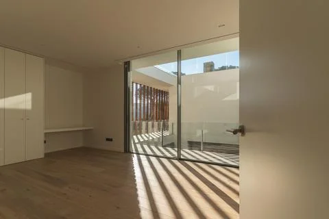 First view of an empty room with the sun's rays coming in after arrival in th Stock Photos