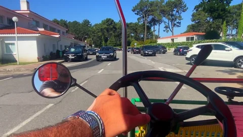 First view of man riding a wealthy buggy through La Toja island in Stock Footage 250941483