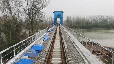 The first view of the train on the railway bridge Vídeo Stock 300580811