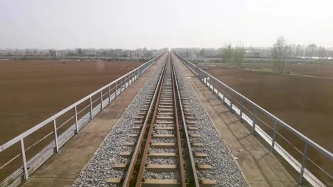 The first view of the train on the railway bridge Stock Footage 300580813