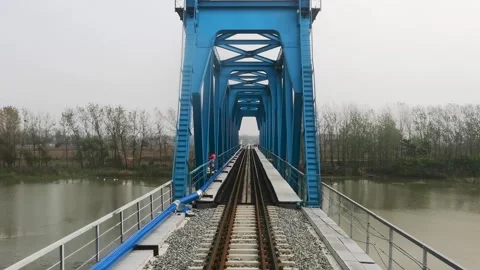 The first view of the train on the railway bridge Stock Footage 300580818
