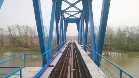 The first view of the train on the railway bridge Stock Footage 300580825