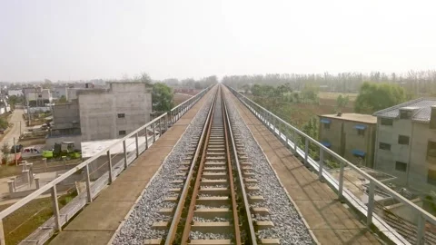 The first view of the train on the railway bridge Stock Footage 300580848