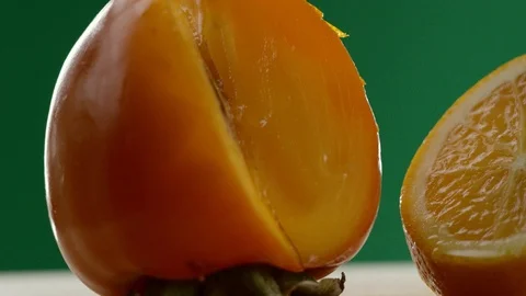 First we see a persimmon, then the video moves from left to right and we see an Stock Footage 108558948