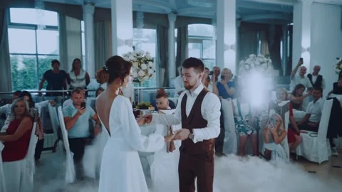The first wedding dance of the bride and groom on the wedding day at the celebra Stock Footage 164659548