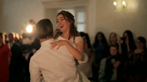 First wedding dance of a young beautiful married couple in love in restaurant. Stock Footage 79495479