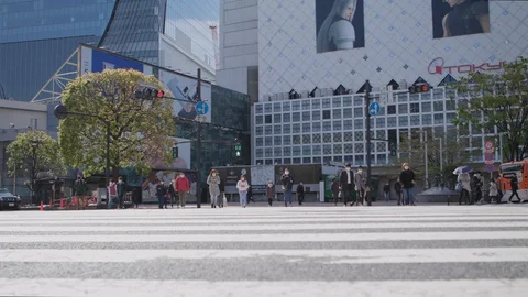 First weekend after emergency declaration of Tokyo Covid-19 crossing medium shot Stock Footage 128164316