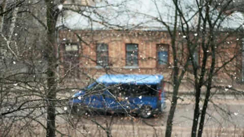 First winter snow falling with big snowflakes white flakes and old house Stock Footage 260473672