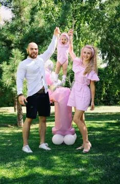 First year of life. birthday. happy parents. family photo shoot. cake. a part Photos