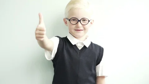 First-year student. A boy in a school uniform smiles and says something Stock Footage 93903810