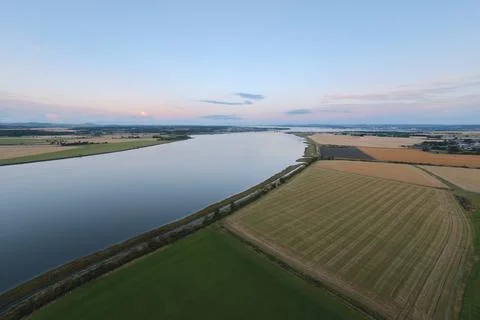 Firth of Forth Estuary and Patterned Farmland at Sunset Stock Photos