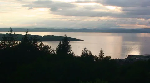 Firth from a small altitude over a forest during sunset Stock Footage 39986800