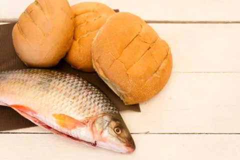 Fish and breads Stock Photos