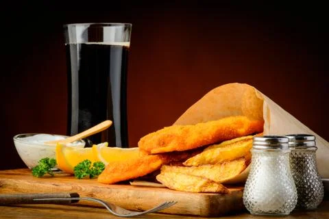 Fish and chips with cola drink Stock Photos