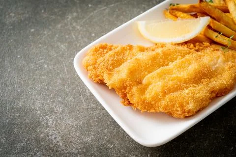 Fish and chips - fried fish fillet with potatoes chips Stock Photos