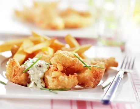 Fish and chips served on a plate Stock Photos