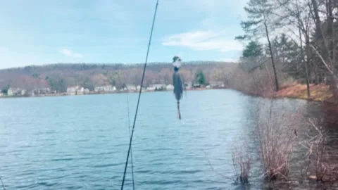 FISH BAIT ON HOOK BLOWING IN WIND Stock Footage 182480434