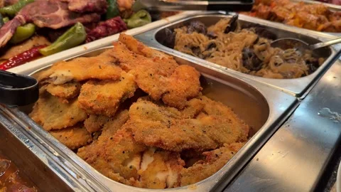 Fish in batter Crisp golden battered fish sizzling gently, embodying the essence Stock Footage 306275417