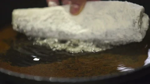 Fish is being fried on the frying pan Stock Footage 61520772