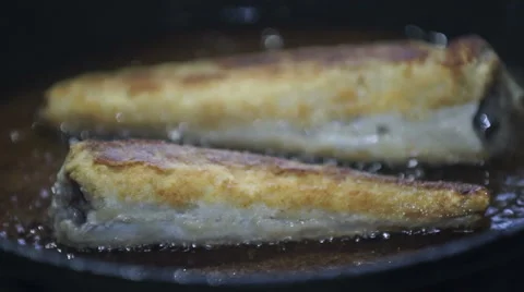 Fish is being fried on the frying pan Video stock 61520897