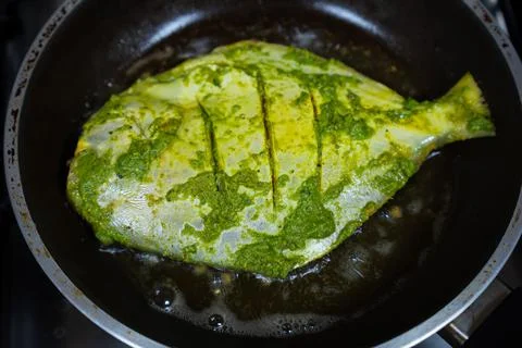 Fish being fried Stock Photos