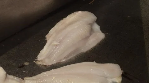 Fish is being fried on a plate Stock Footage 43078341