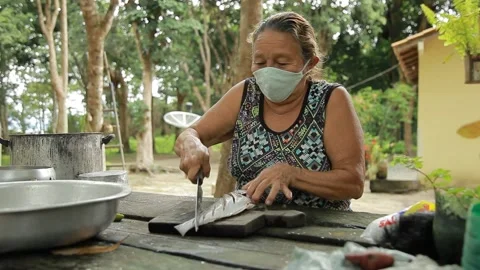 Fish being prepared by old lady Video stock 153097781