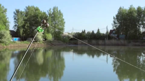 Fish bite. Fish caught on the bait, the rod with a bell twitches Stock Footage 136146505