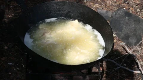 Fish into boiling oil close up Stock Footage 57503976