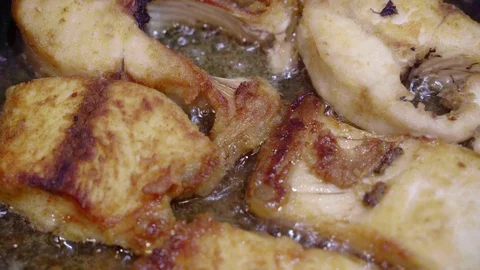 Fish boils in oil Stock Footage 107824152