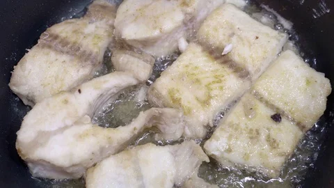 Fish boils in oil Stock Footage 107824176