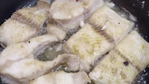 Fish boils in oil Stock Footage 107824186