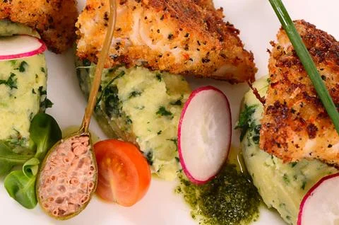 Fish in breadcrumbs with mashed potatoes Stock Photos