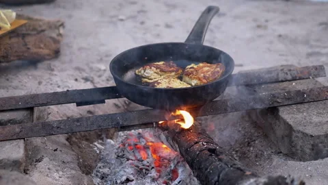 Fish cakes are fried on fire Stock Footage 293272315