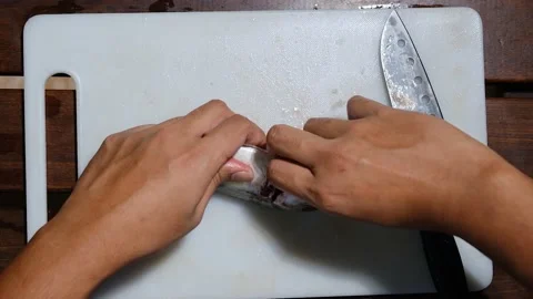 Fish cleaning and remove internal organ Stock Footage 155029736