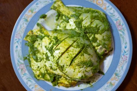 Fish coated in green paste Stock Photos