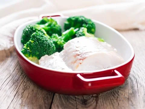 Fish cod baked in the oven with broccoli - healthy diet healthy food. Rusti.. Stock Photos