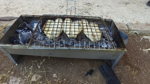 The fish is cooked on charcoal. Stock Footage 77426549