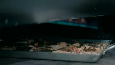 Fish is cooked in a gas oven. Video stock 236629581