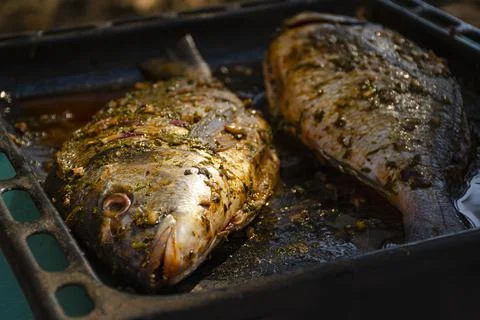 Fish cooked in the oven on a baking sheet is incredibly tasty. Especially if  Stock Photos