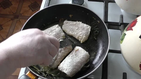 Fish is cooked in a pan Stock Footage 160947241
